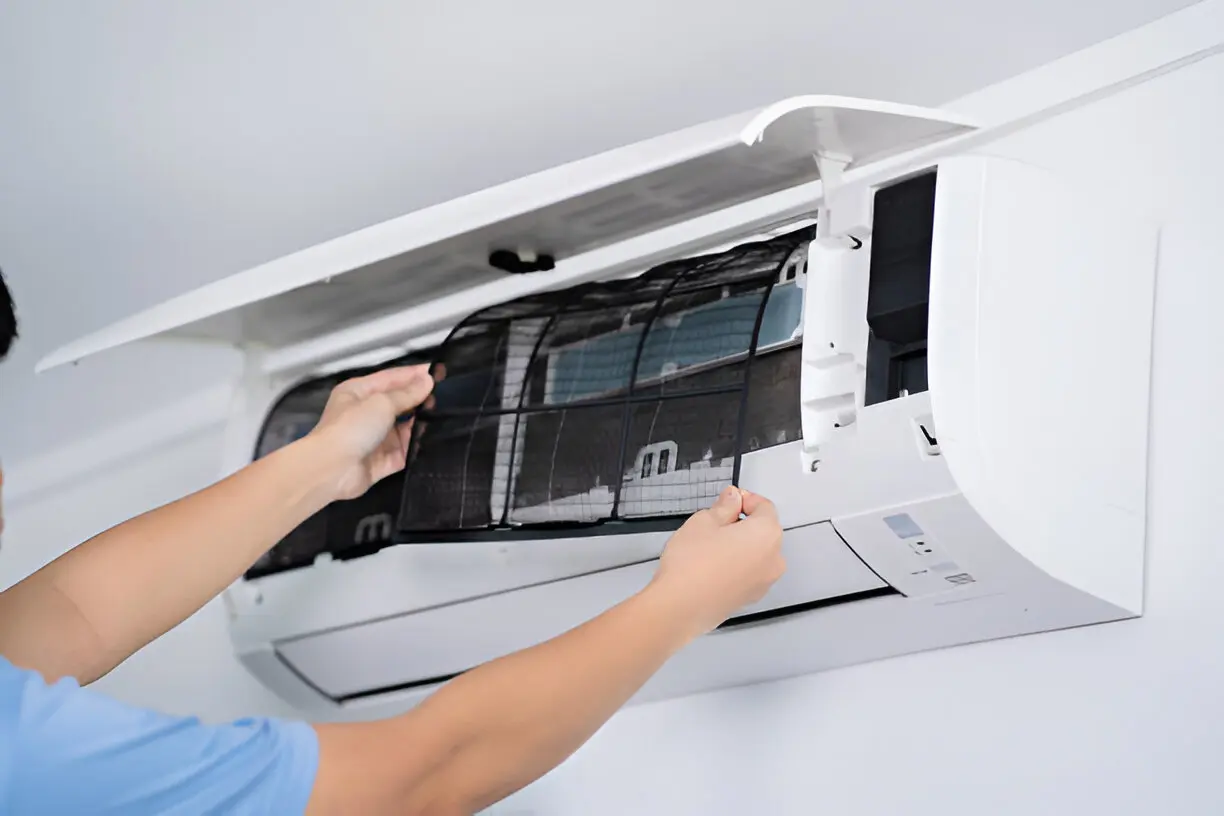 Home 12 Repair specialist fixing a residential air conditioner unit in Bonita Springs