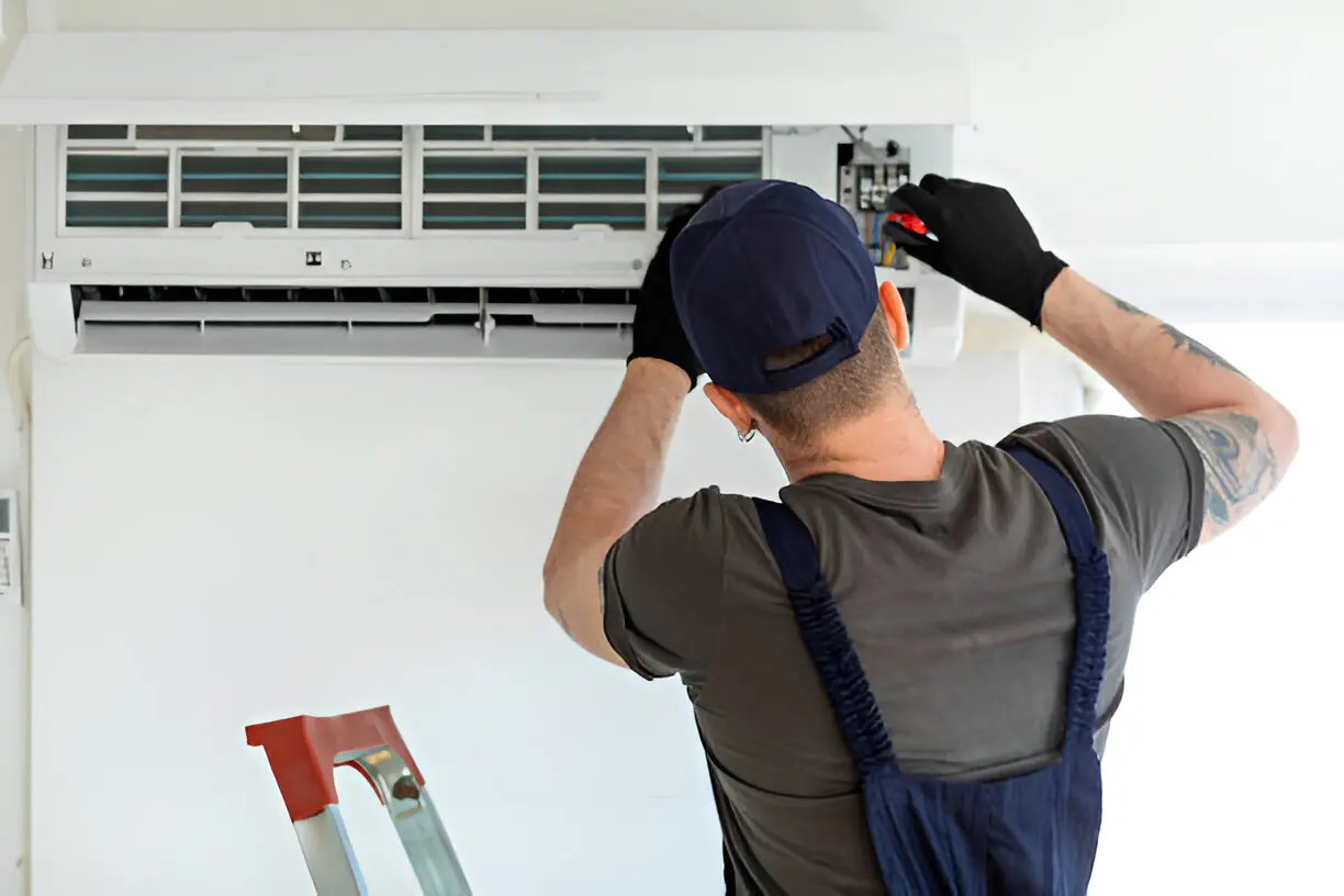 Home 18 Local Air Conditioning Contractor in Bonita Springs tuning up home AC system